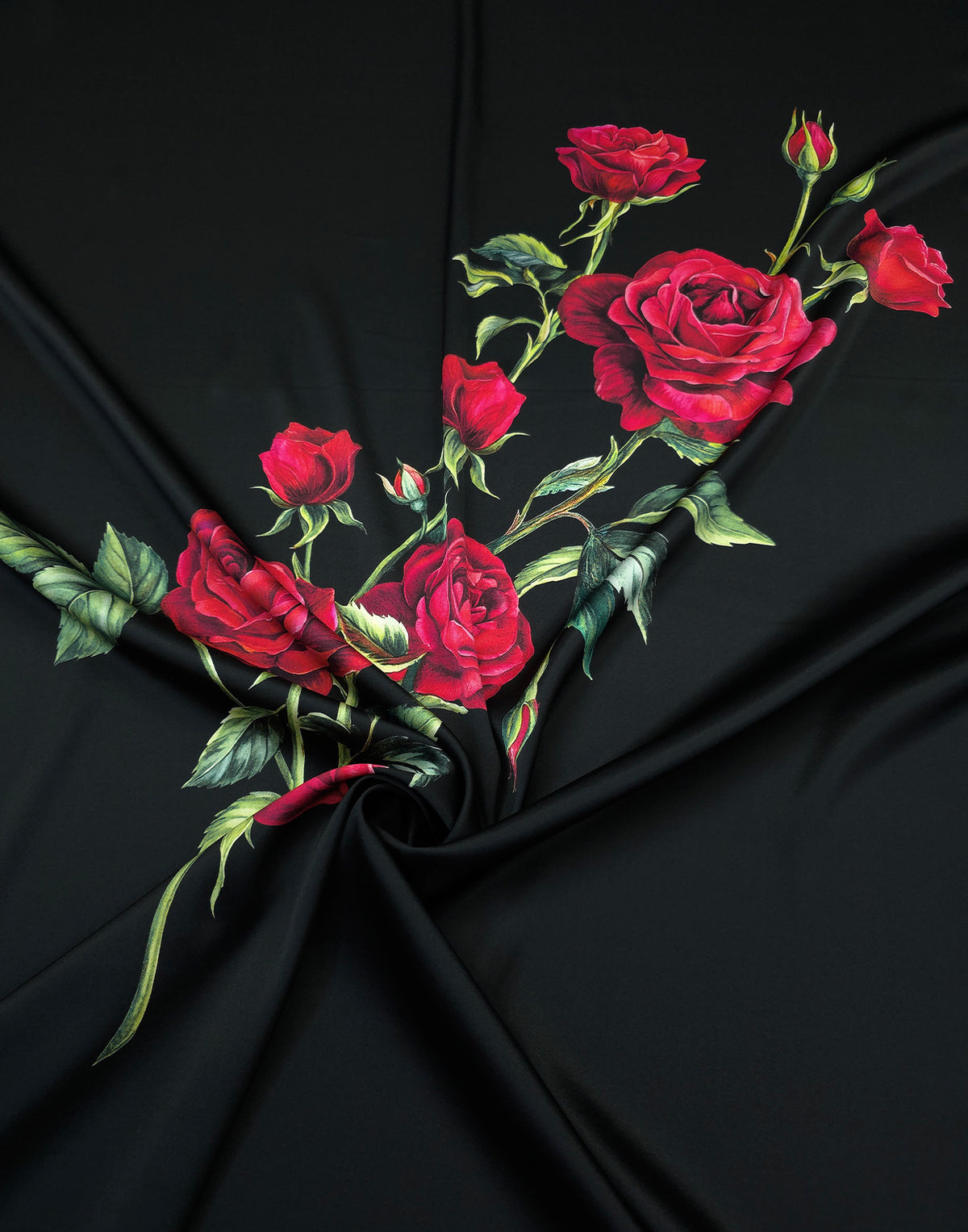 Mulberry silk satin on black with a cascading arrangement of red roses, rosebuds and green leaves