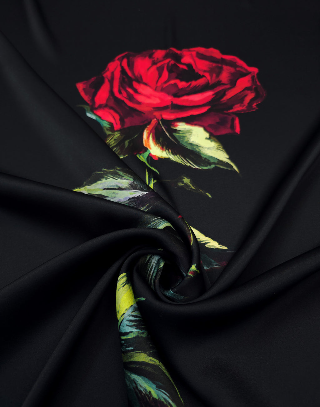 Red rose with green leaves printed on black silk satin fabric.