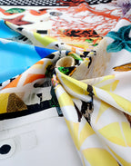 Lustrous Italian Mulberry silk satin displaying the Capri landscape, colorful architecture and Mediterranean marine motifs.