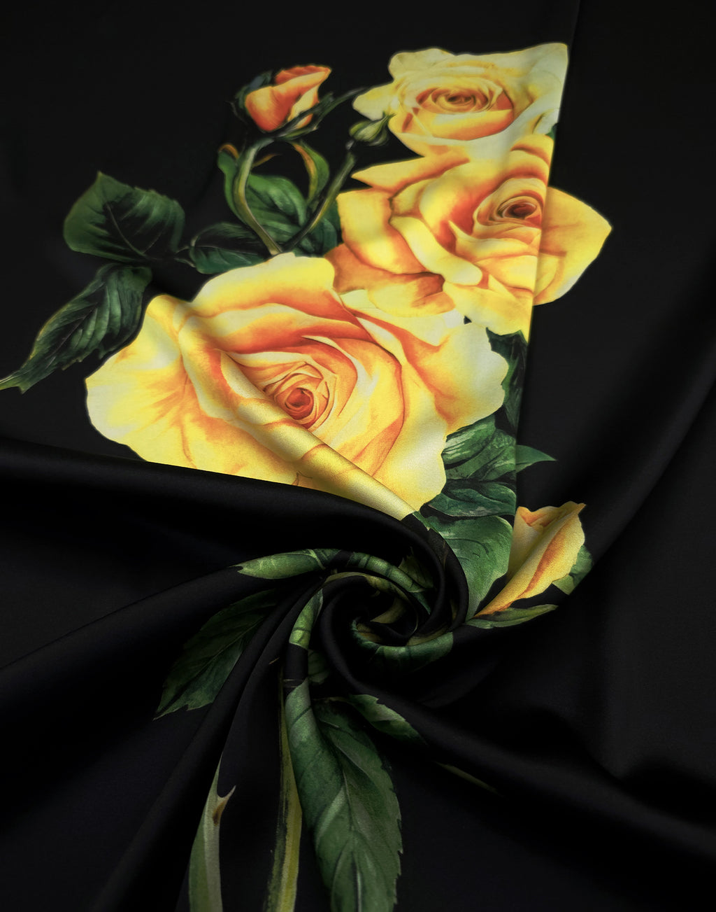 Italian silk satin with luminous yellow roses and green foliage against a rich black background