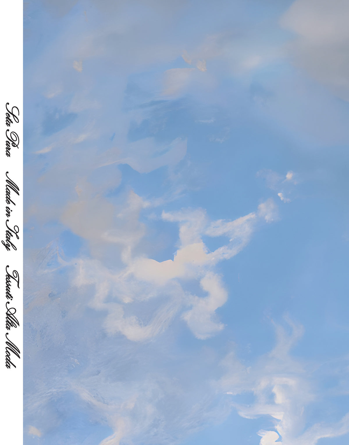 Italian mulberry silk satin featuring a soft sky-blue background with luminous white clouds