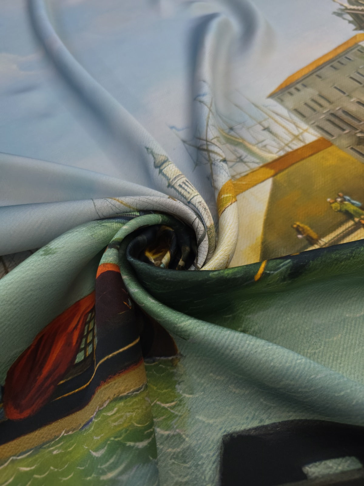 Luxury Italian silk satin fabric with a Venice print in turquoise blue, green and golden tones