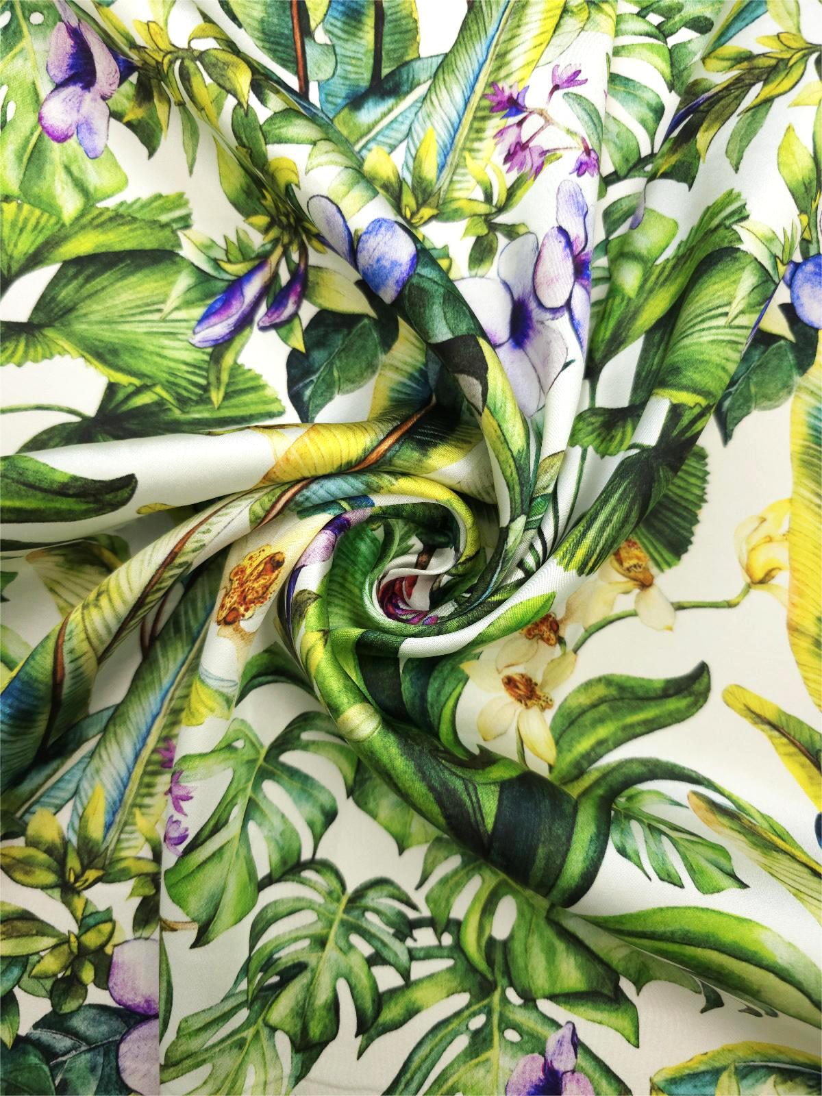 Mulberry silk satin print featuring large monstera leaves, fan-shaped foliage, purple flowers and pale orchids.