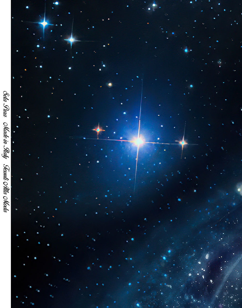 Natural silk satin fabric with a deep blue cosmic print featuring luminous stars and celestial details