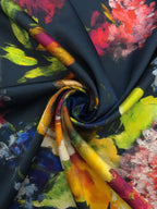 Mulberry silk satin arranged in soft folds, featuring vibrant painterly flowers on a midnight blue background.