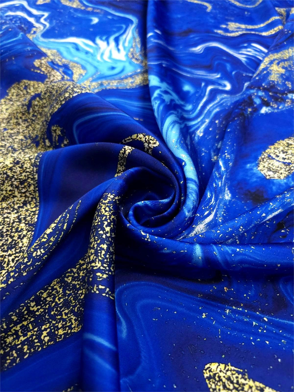 Royal blue Italian Mulberry silk satin featuring flowing turquoise, white and gold abstract details
