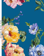 Fluid Italian silk satin displaying its luminous surface and colorful floral print on a turquoise blue ground.
