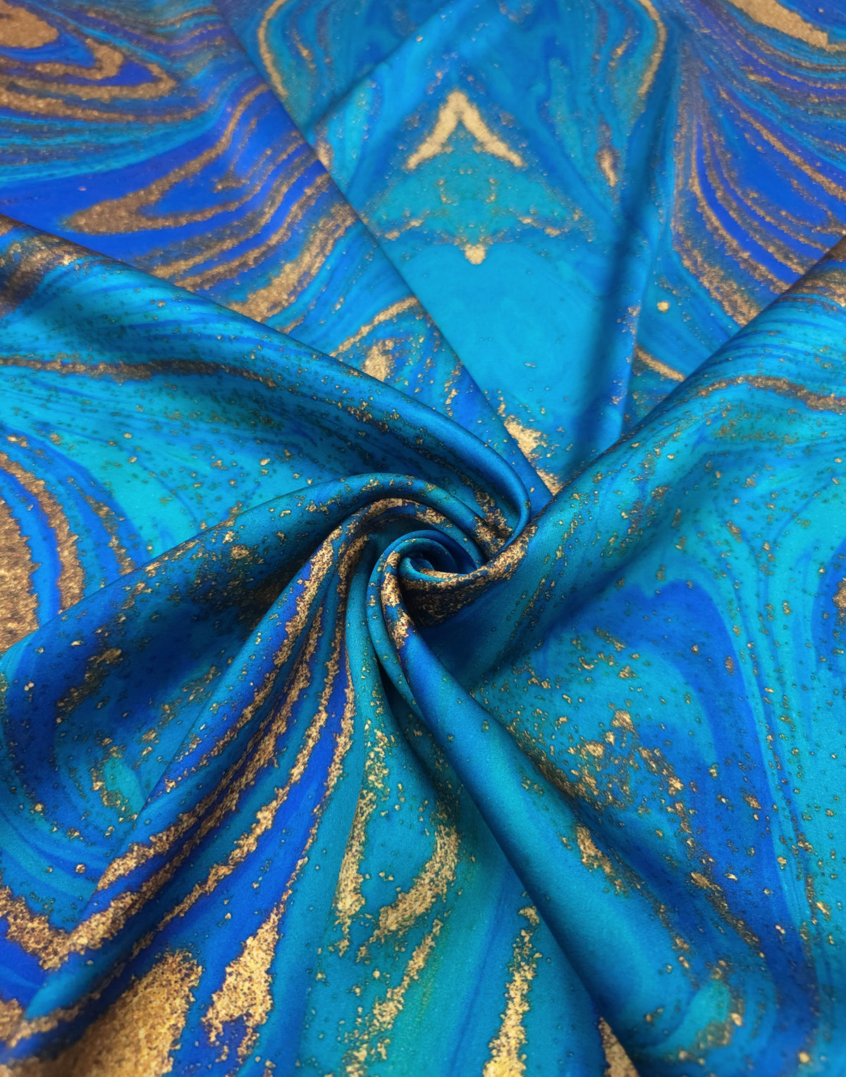 Italian Mulberry silk satin with a turquoise, electric blue and gold marbled abstract print