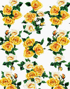 Lustrous Italian silk satin featuring yellow and cream roses with green leaves on a white background.